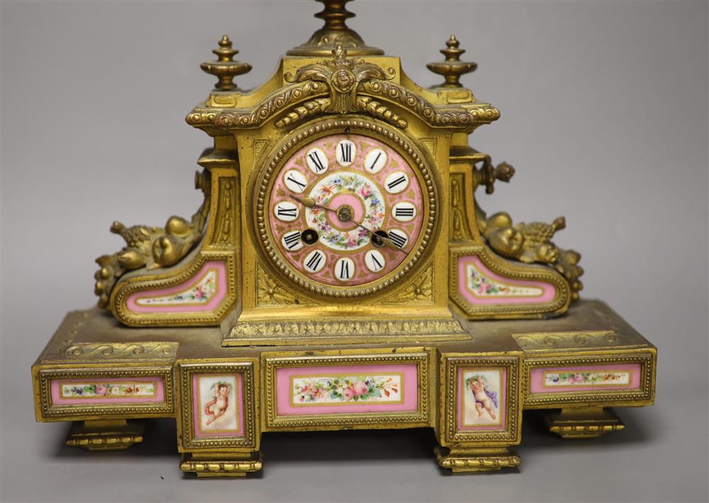 A 19th century French gilt metal and porcelain inset mantel clock, height 37cm